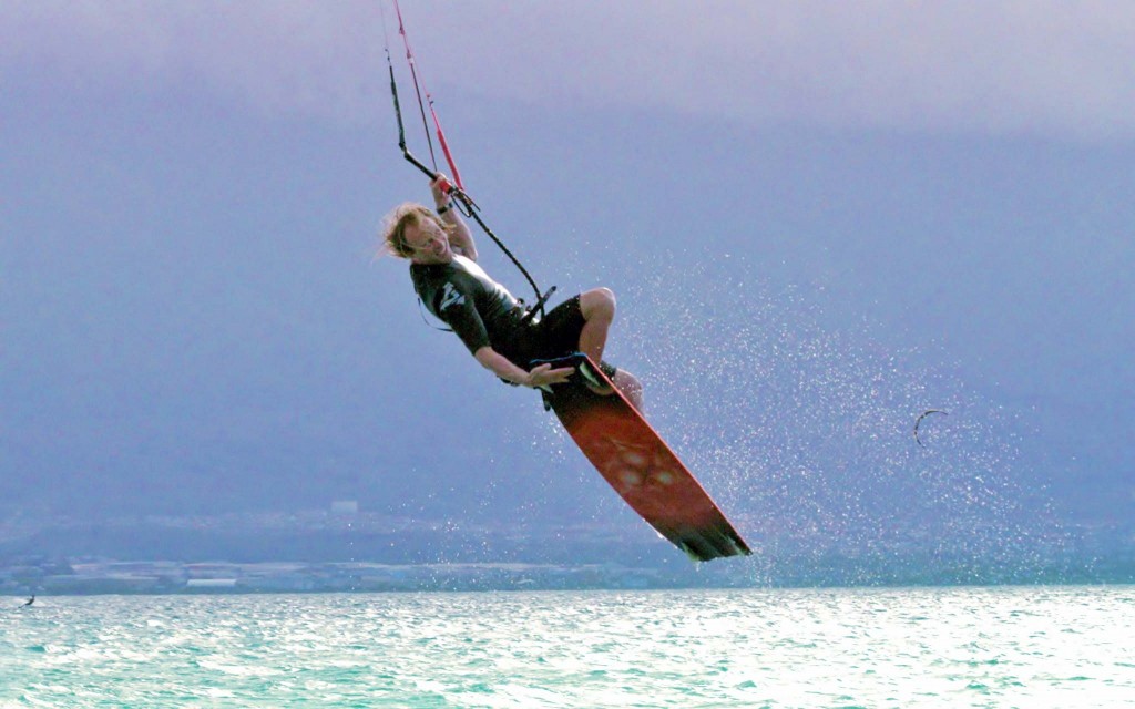 Troy-front-roll-tail-grab-to-handle-pass Maui Kiteboarding Instructor Troy Schafer Unhooked Tricks